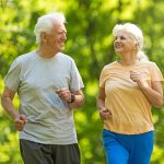 active elderly couple out for a jog